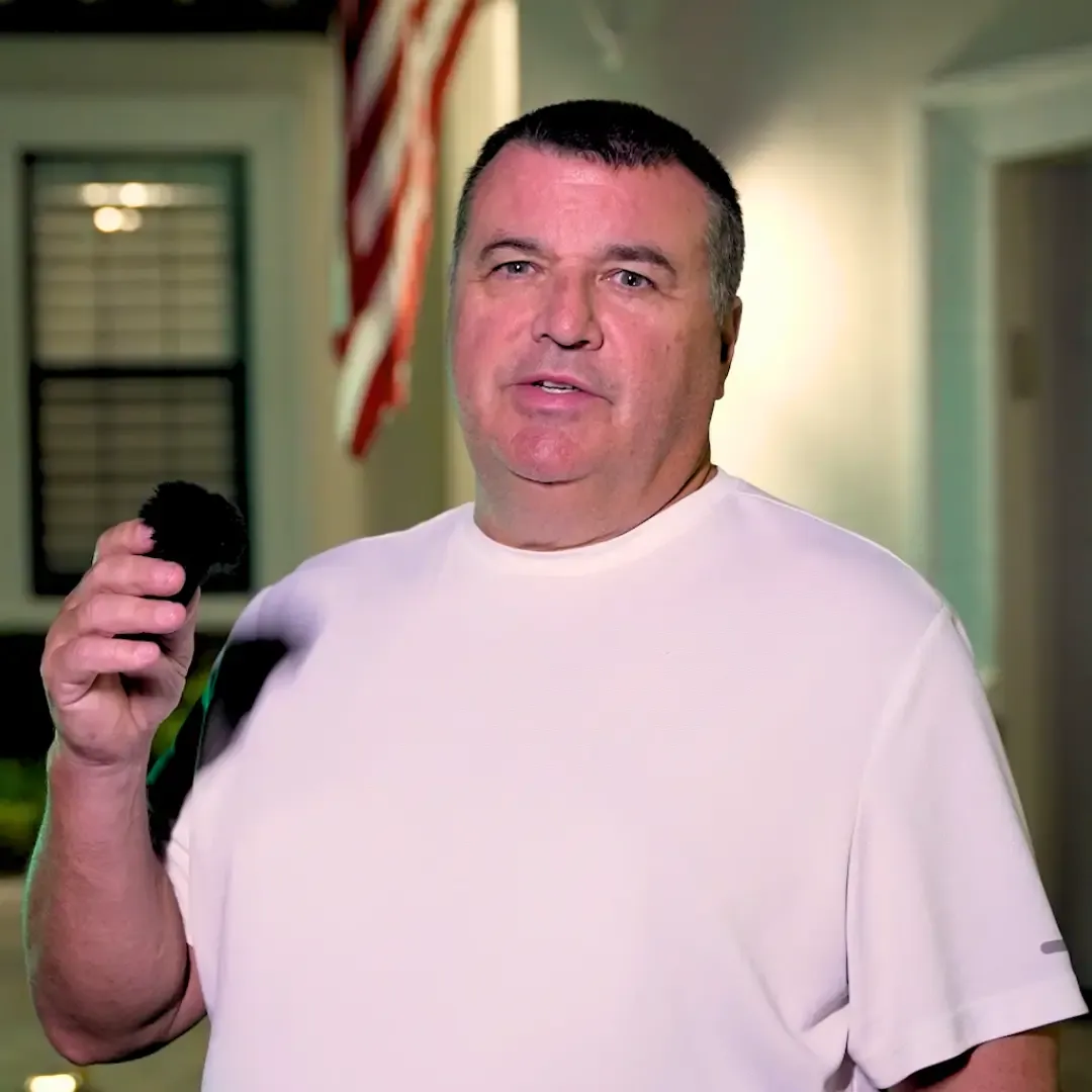 Video testimonial thumbnail — Neil and Lambi Newsham